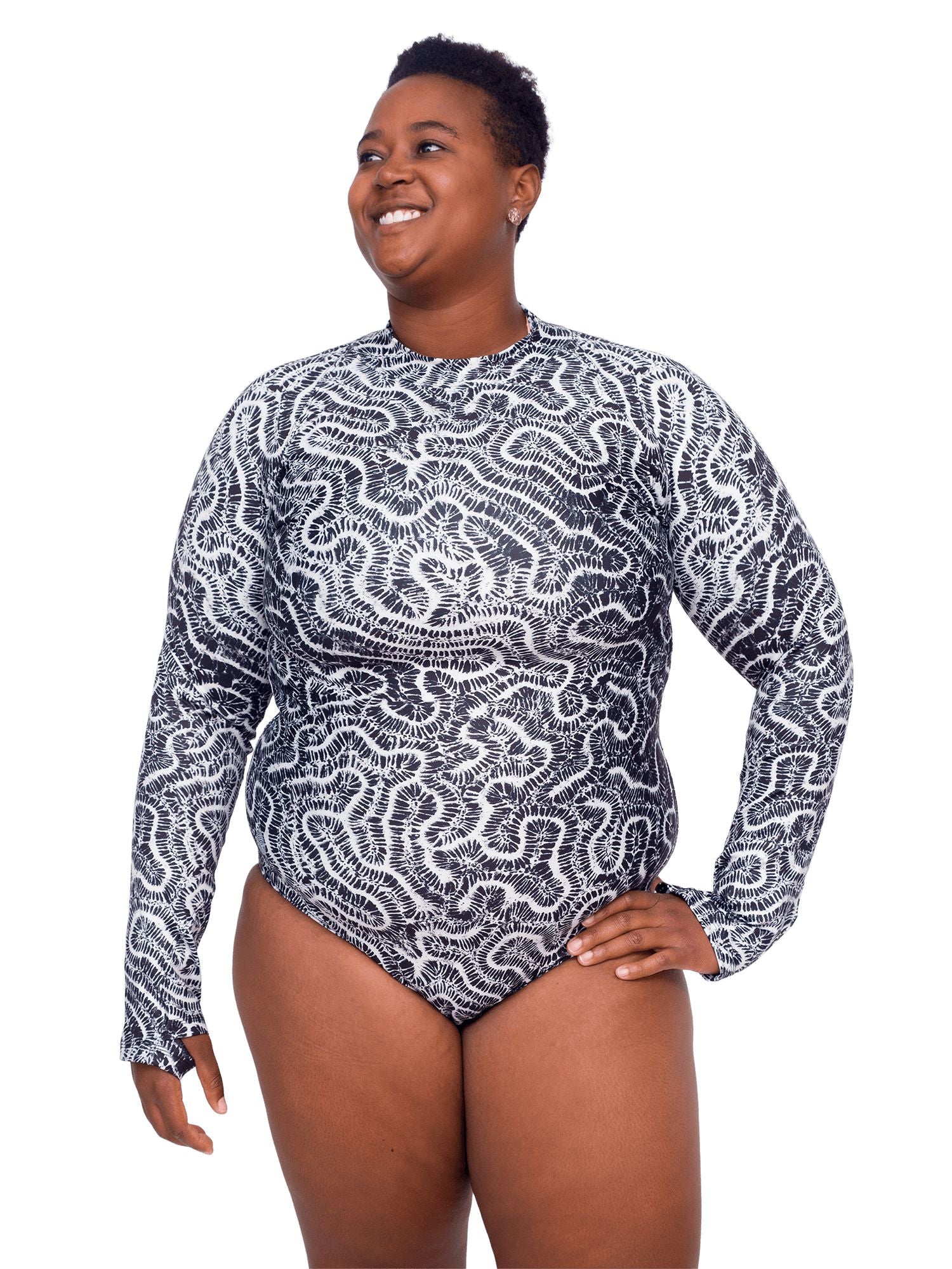 Model: Candace is a PhD candidate in the Predator Ecology & Conservation Lab at FIU and the first Bahamian scientist dedicated specifically to shark research. She is 5'9", 230 lbs, and is wearing a 2XL Sun Suit.