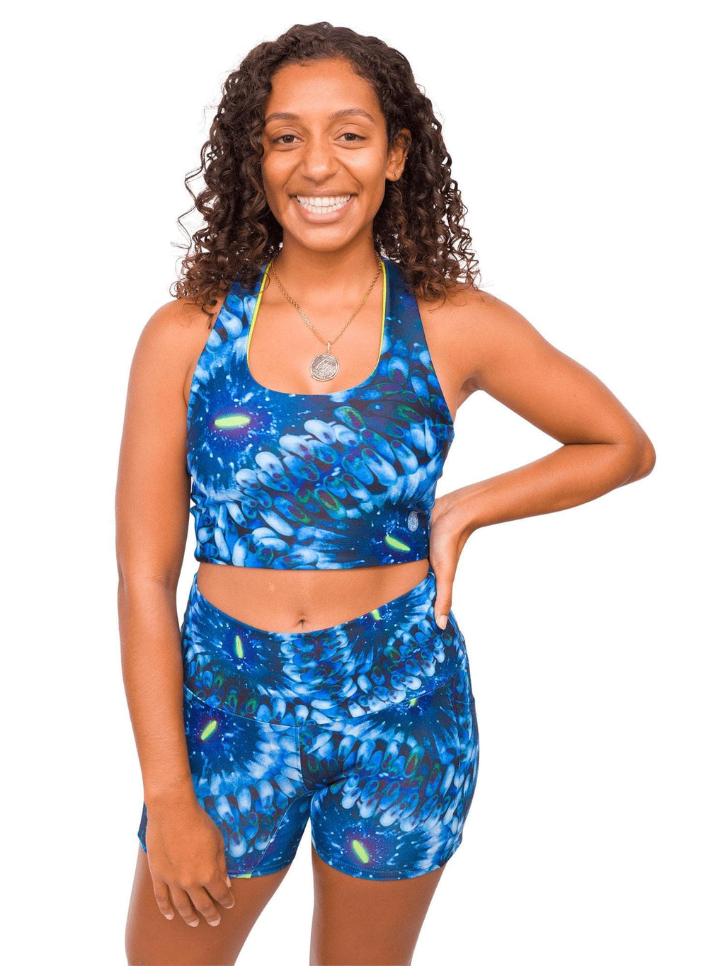 Model: Gabrielle works in coral reef restoration and strives to end single-use plastic in her daily routine. She is 5&#39;4&quot;, 135lbs, 34C and is wearing a M top and M shorts.