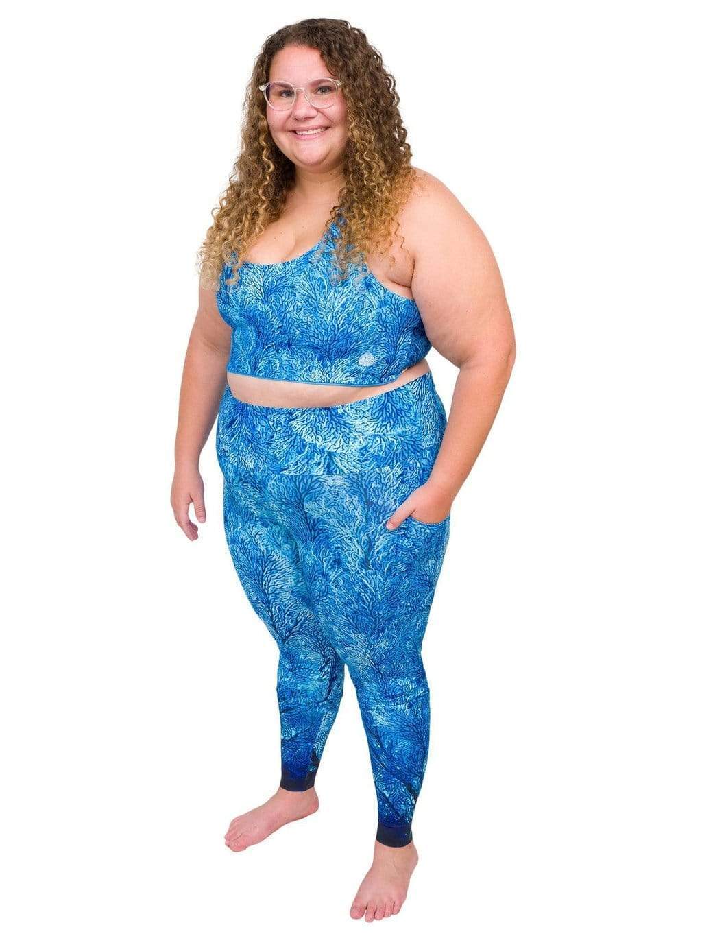 Model: Angela is working towards her Master of Professional Science in Marine Conservation. She is 5&#39;6&quot;, 235 lbs, 42E and is wearing a 2XL top and legging.