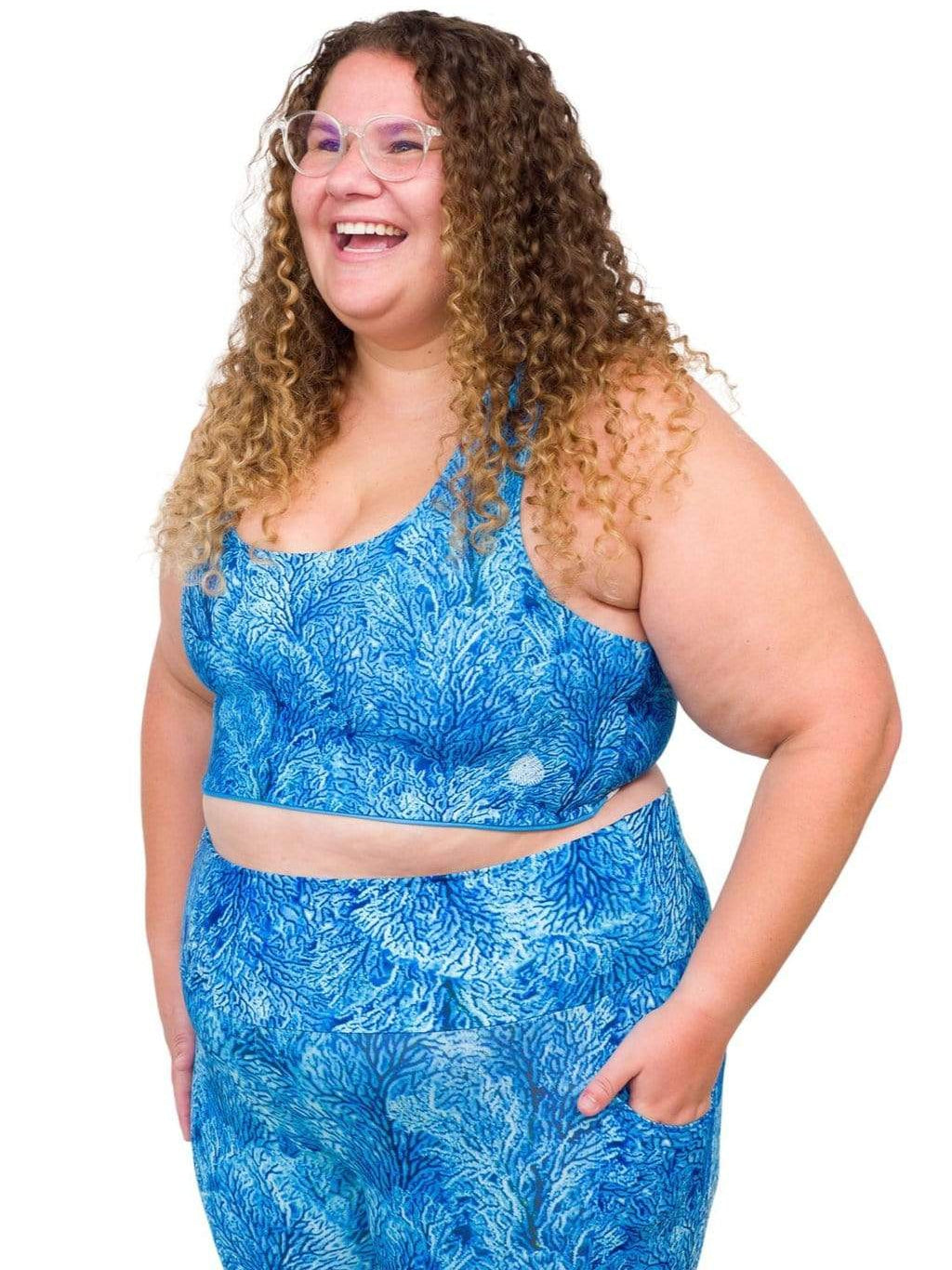 Model: Angela is working towards her Master of Professional Science in Marine Conservation. She is 5&#39;6&quot;, 235 lbs, 42E and is wearing a 2XL top and legging.