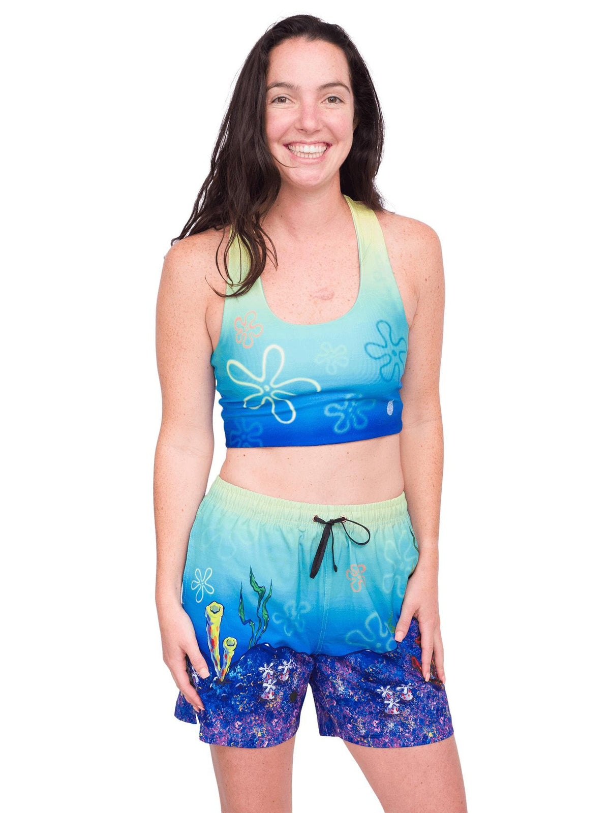 Model: Maddie is the Program &amp; Outreach Director at Debris Free Oceans and a restoration ecology educator. She is 5’8”, 135lbs, and wearing a size M top and S short.