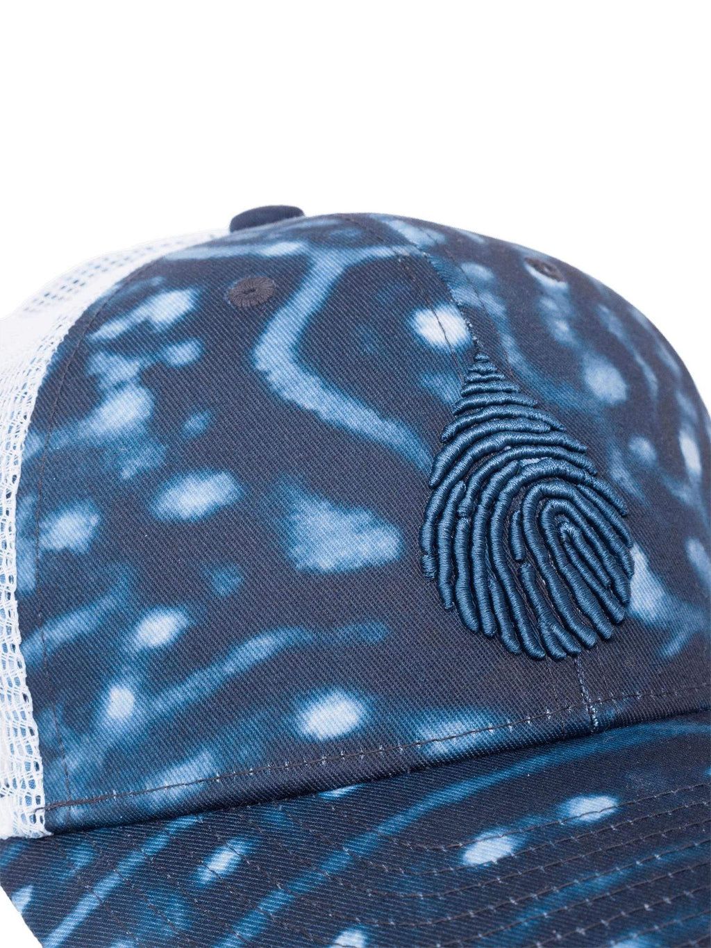 Close up view of a waterlust whale shark printed recycled trucker cap hat with waterlust logo emroidered on front