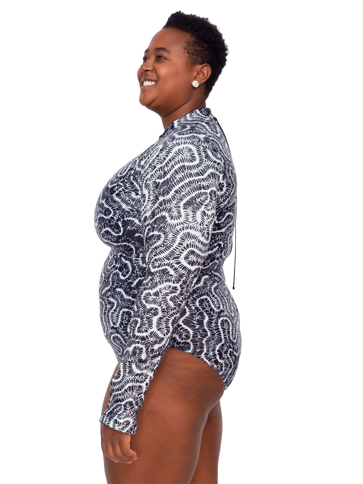 Model: Candace is a PhD candidate in the Predator Ecology & Conservation Lab at FIU and the first Bahamian scientist dedicated specifically to shark research. She is 5'9", 230 lbs, and is wearing a 2XL Sun Suit.