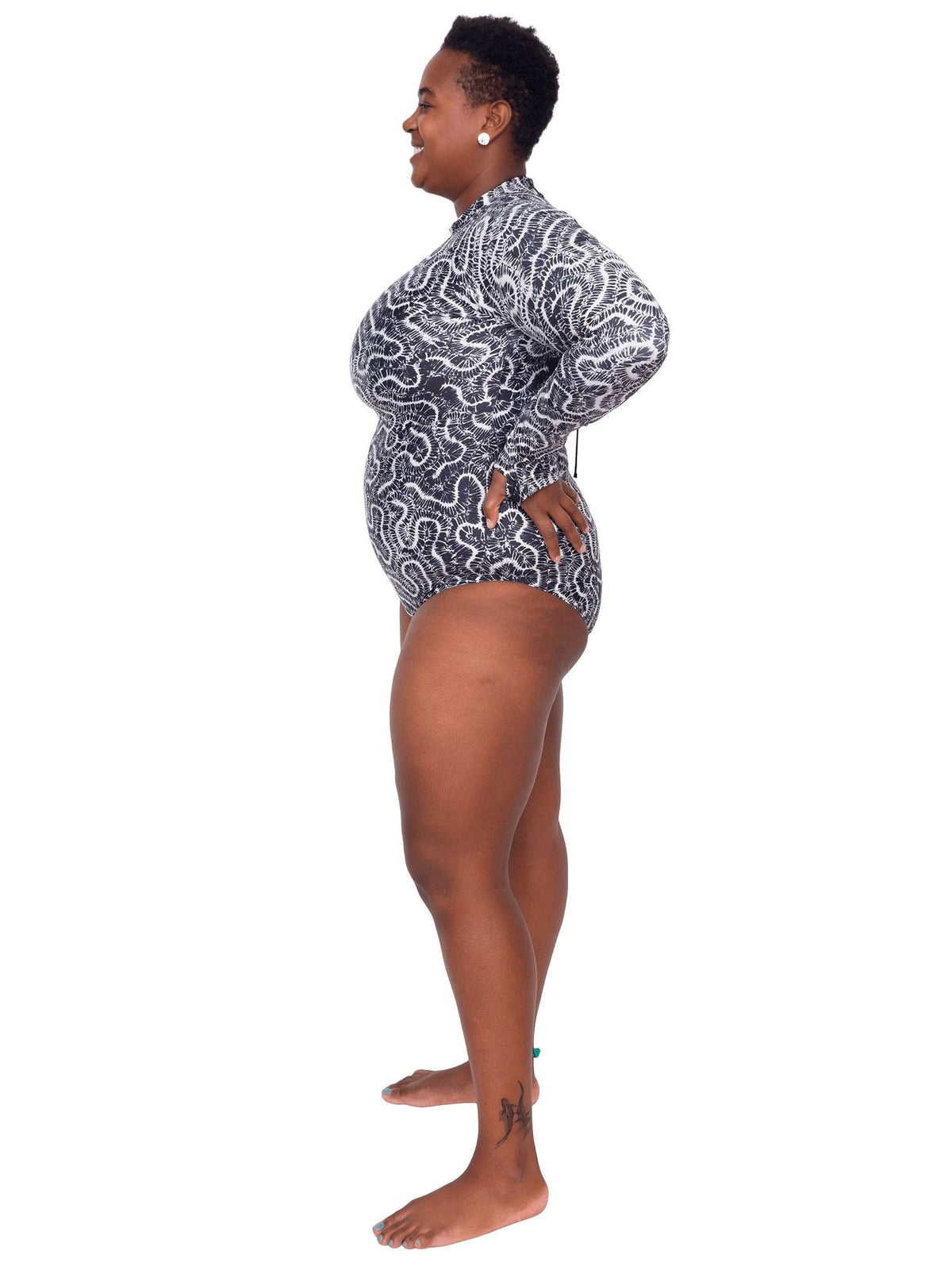 Model: Candace is a PhD candidate in the Predator Ecology &amp; Conservation Lab at FIU and the first Bahamian scientist dedicated specifically to shark research. She is 5&#39;9&quot;, 230 lbs, and is wearing a 2XL Sun Suit.