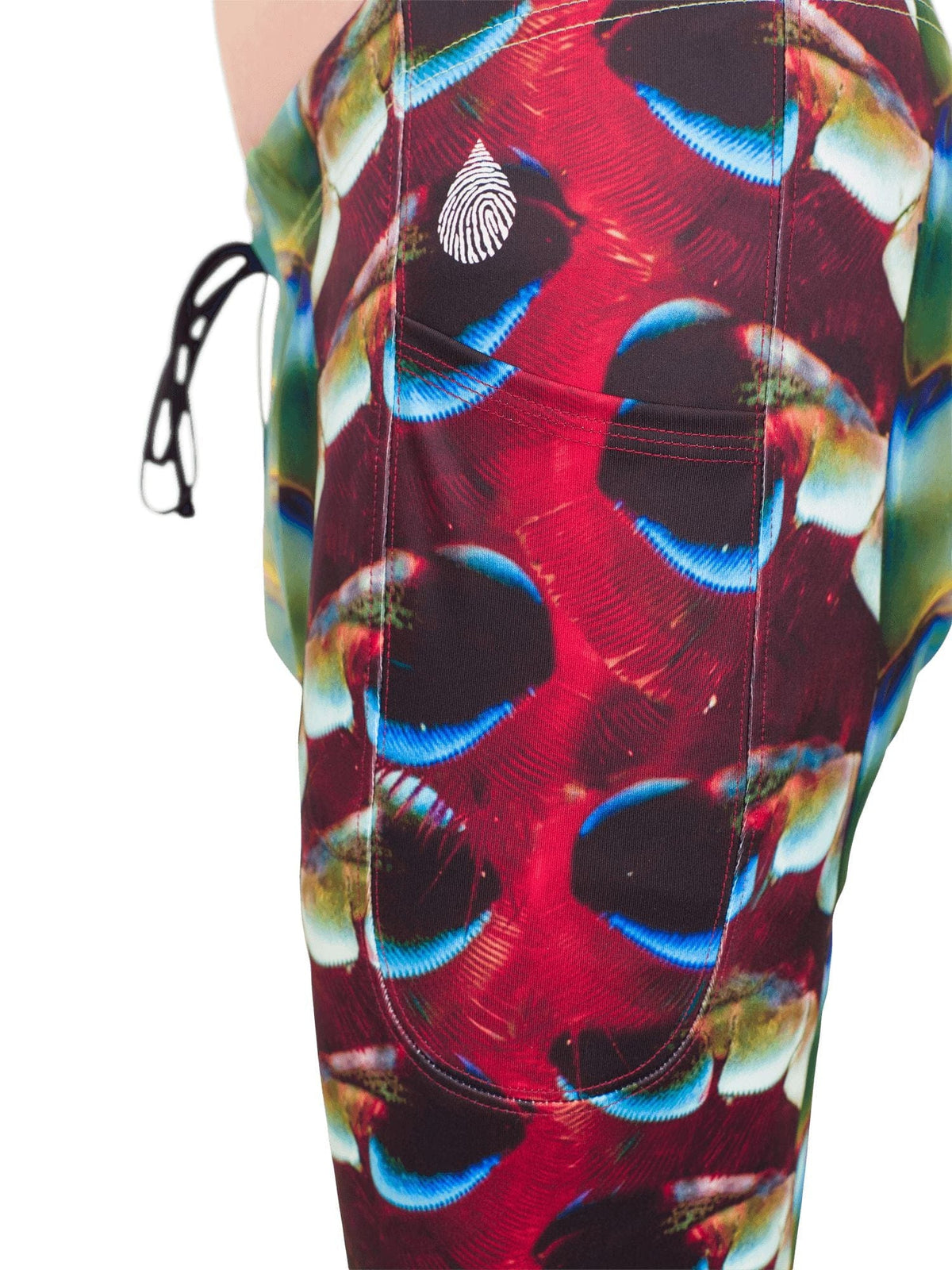 Close up side view of the side leg pocket on the men&#39;s mantis shrimp legging showing the vibrant colorful printing.