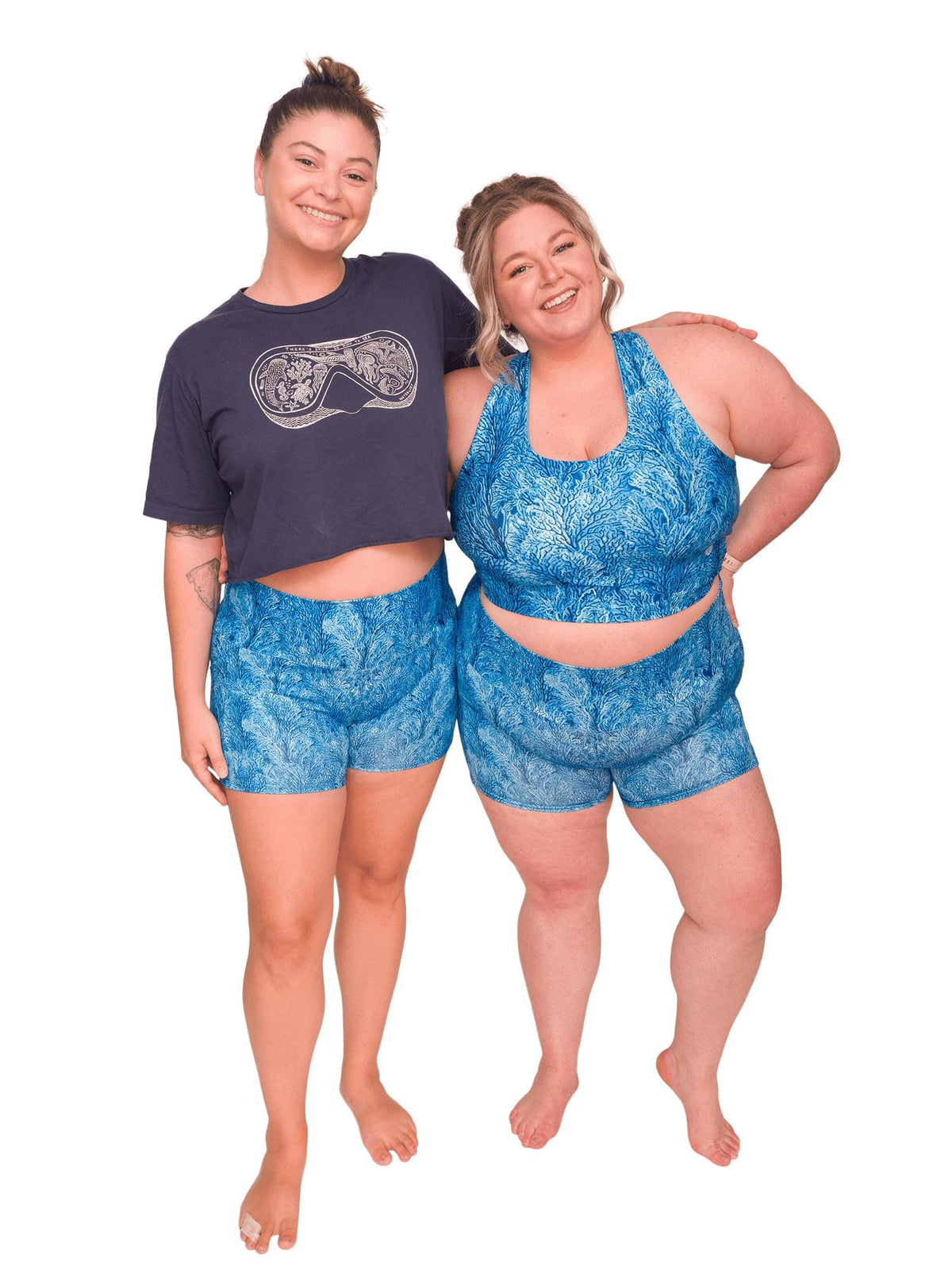 Model: Camilla (Left) is 5&#39;8&quot;, 190 lbs, a 36C, and wearing an XL shorts and L tee. Chelsea (Right) is 5&#39;2&quot;, 230 lbs, 40DD and is wearing 3XL shorts and a 3XL reversible top.