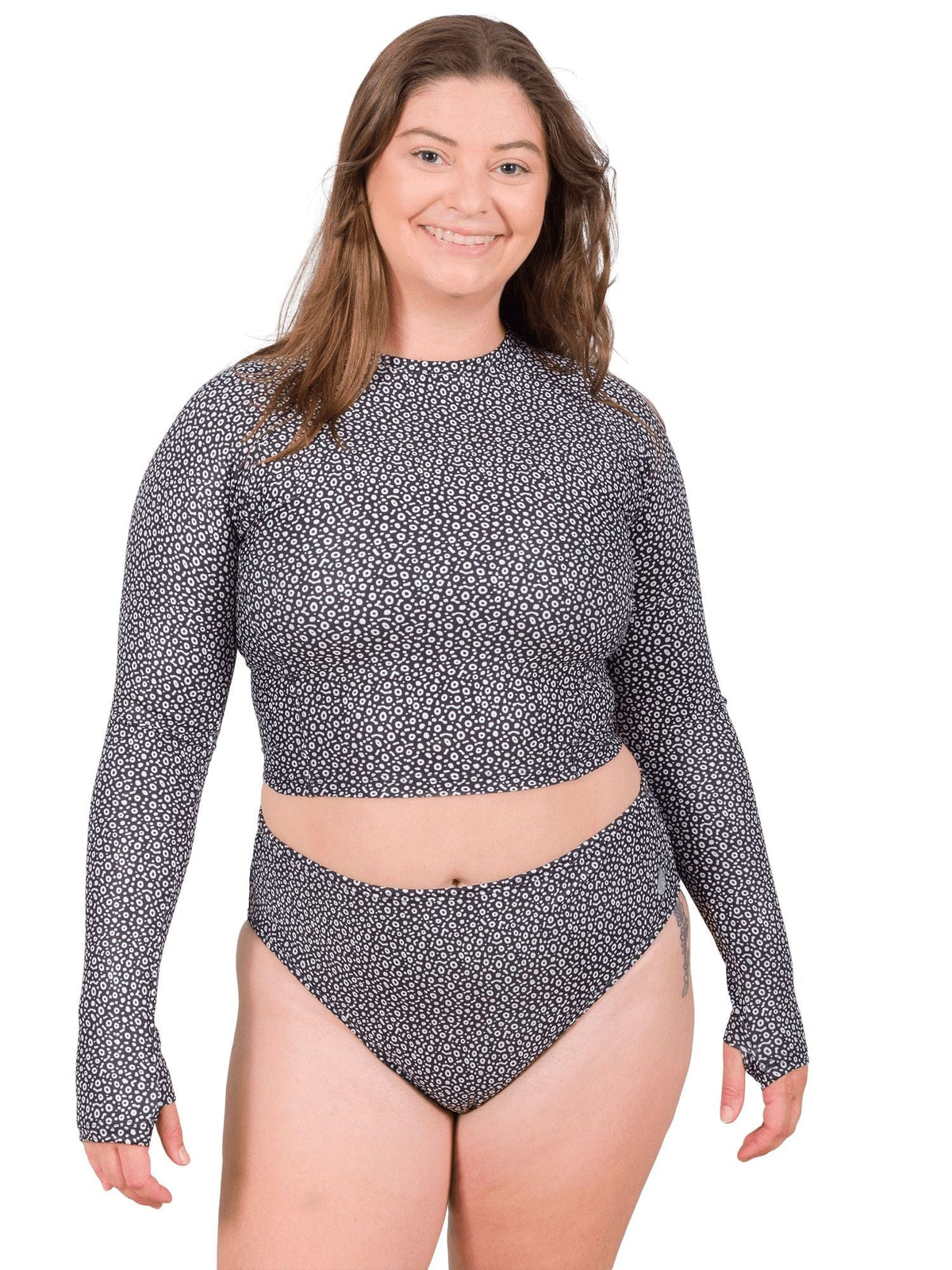 Model: Camilla is the Operations Manager here at Waterlust. She loves using her camera to communicate marine conservation issues. She is 5&#39;8&quot;, 195 lbs and is wearing an XL High-Waisted Bikini Bottom and an XL Cropped Rashguard.