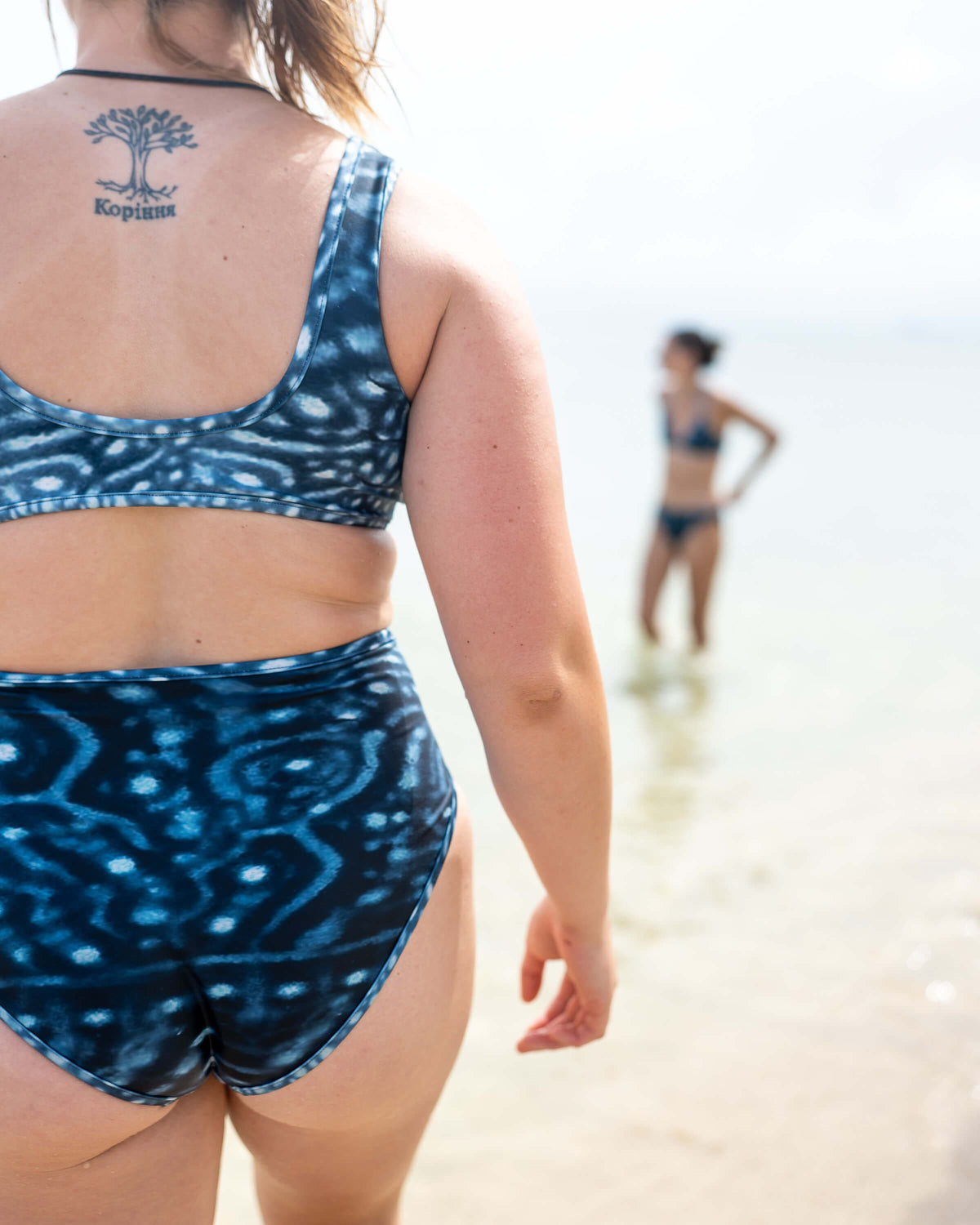 Model: Cailyn is a master&#39;s student conducting research on coral bleaching in Florida. She is 5&#39;6&quot;, 165 lbs, and is wearing a M Scoop Bikini Top and M High-Waisted Bikini Bottom.