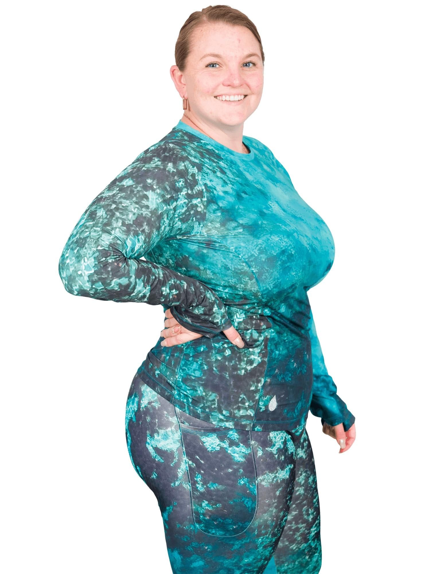 Model: Erin works to educate students and the community about conservation issues in South Florida. She is 5'5", 225lbs, and is wearing a XL Women's Crew Neck Sun Shirt a 3XL legging.