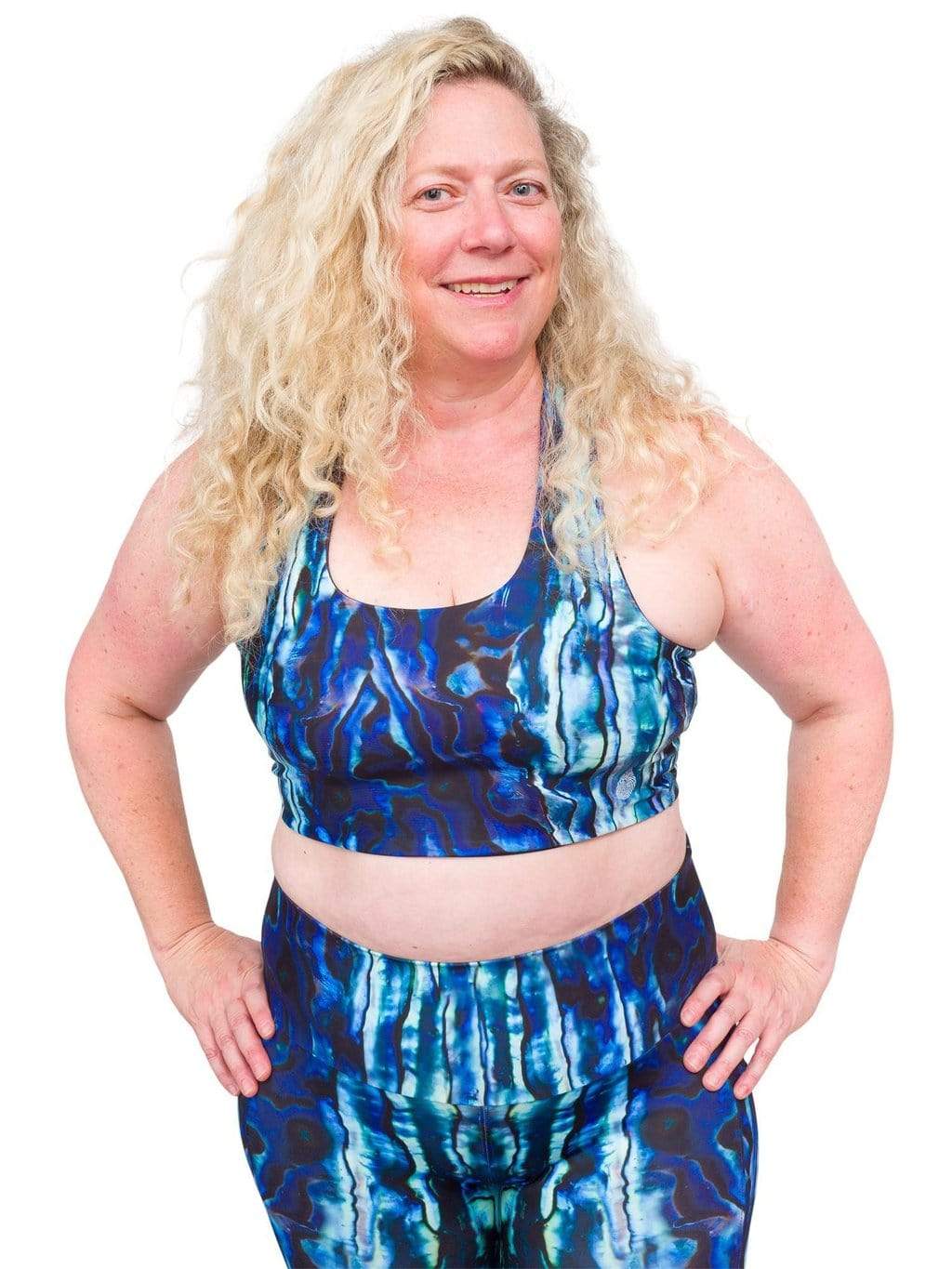 Model: Ruth volunteers for citizen science projects on both salt and freshwater fish and spends as much time as possible in, on, or under the water. She is 5'7", 217 lbs, 40DD and is wearing a 2XL top and legging.