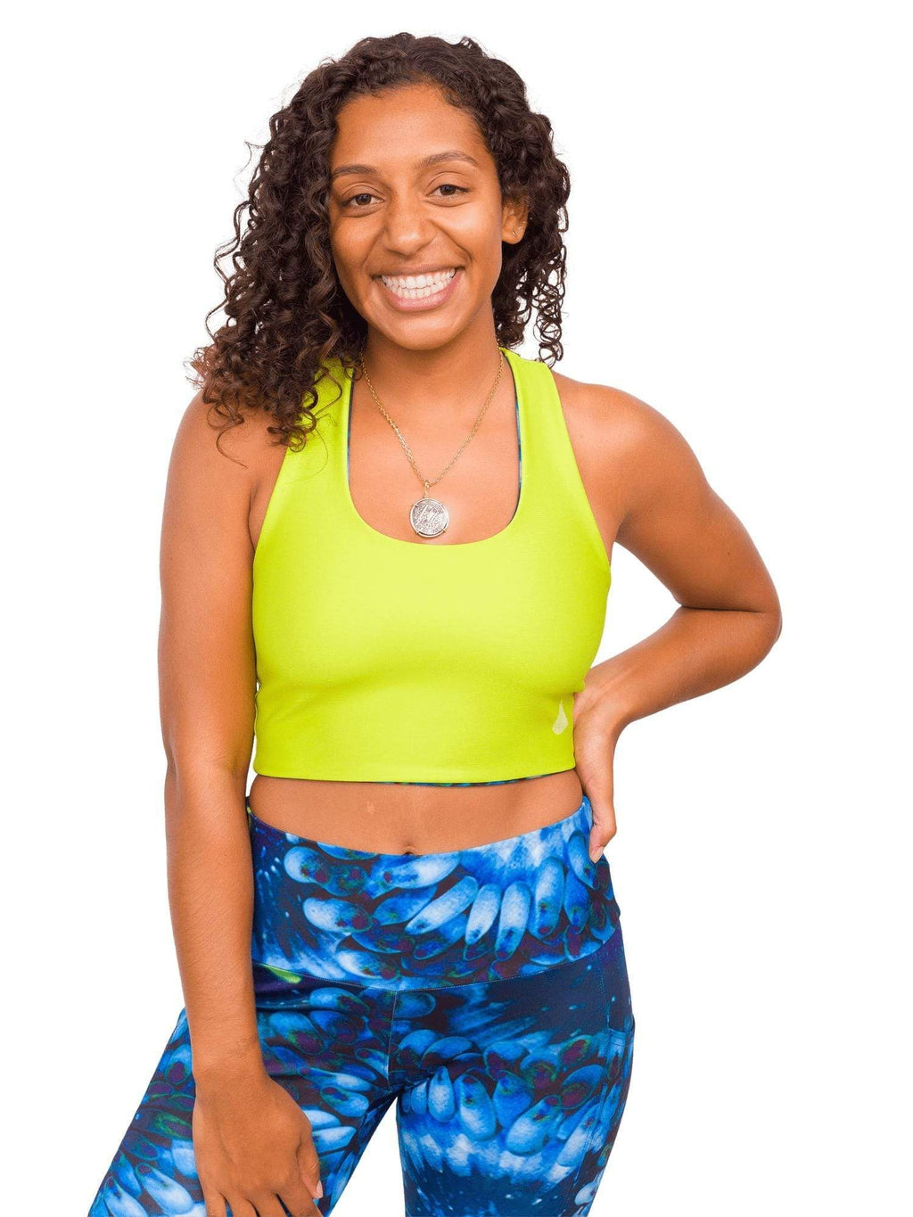Model: Gabrielle works in coral reef restoration and strives to end single-use plastic in her daily routine. She is 5'4", 135lbs, 34C and is wearing a M top and M leggings.