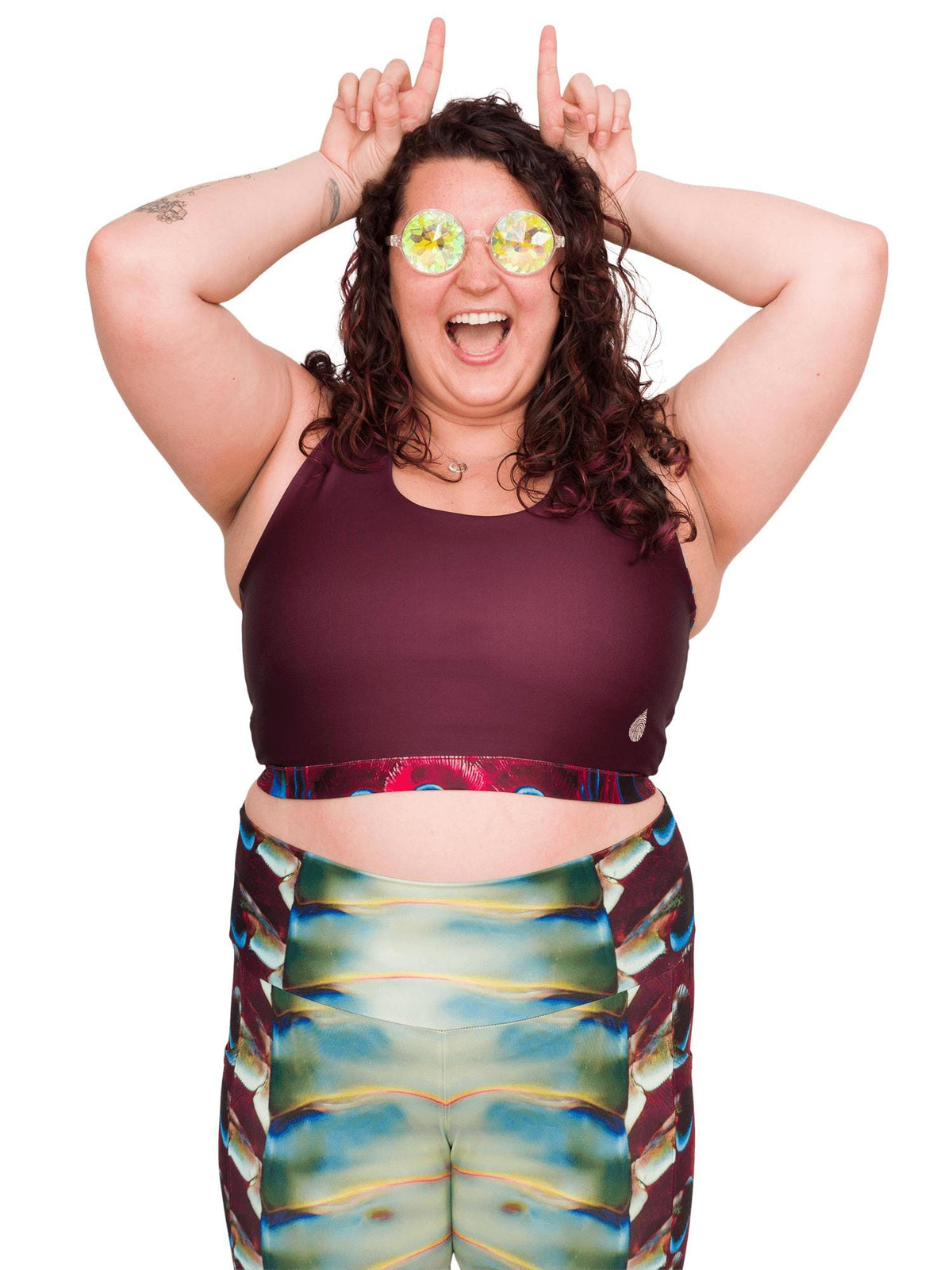 Model: Kela is a marine conservationist who strives to connect students with educational opportunities to help expand the reach of the marine science field. She is 5’5”, 185 lbs, 36F and is wearing a size XL top and legging.