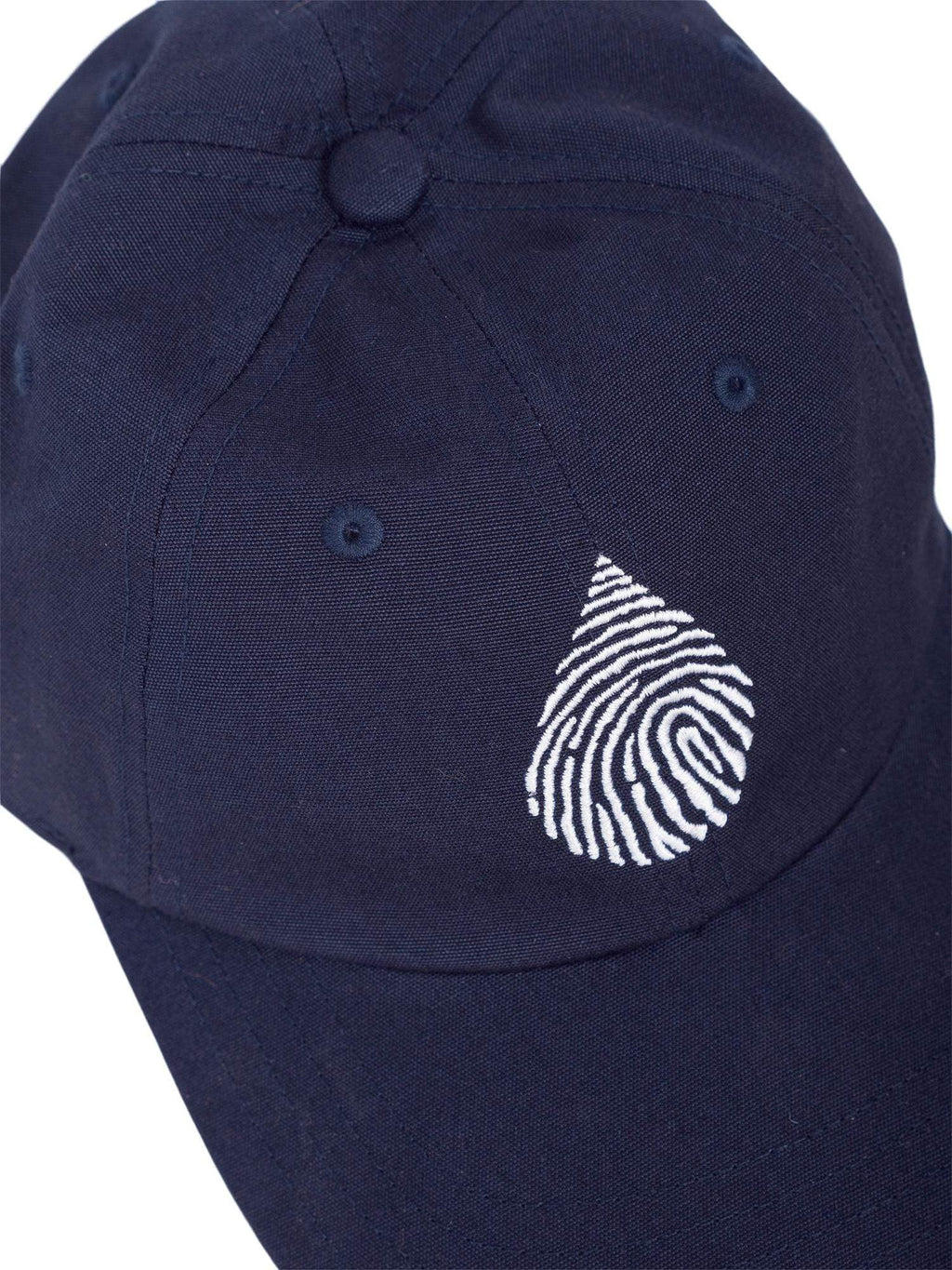 Close up top down view of a waterlust logo embroidered in white on a blue organic cotton dad cap hat