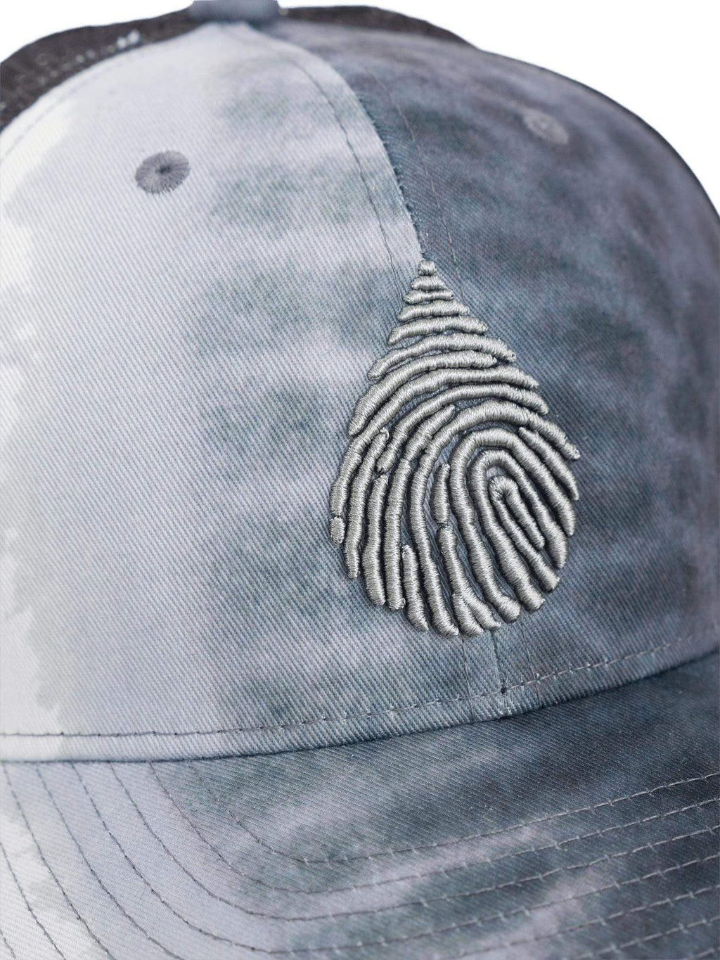 Close up view of the waterlust logo embroidered on a tiger shark printed recycled trucker cap hat